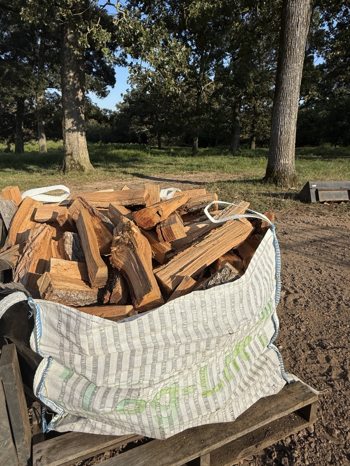 Large Oak Hill Firewood bag filled with split firewood